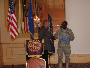 During the January chapter luncheon, Gen. Brundidge (r), presents a token of appreciation to Rich DeSalvo, outgoing chapter vice president, for his contributions to the chapter during his tenure. DeSalvo currently is the branch chief at the Defense Information Systems Agency-EUROPE. 